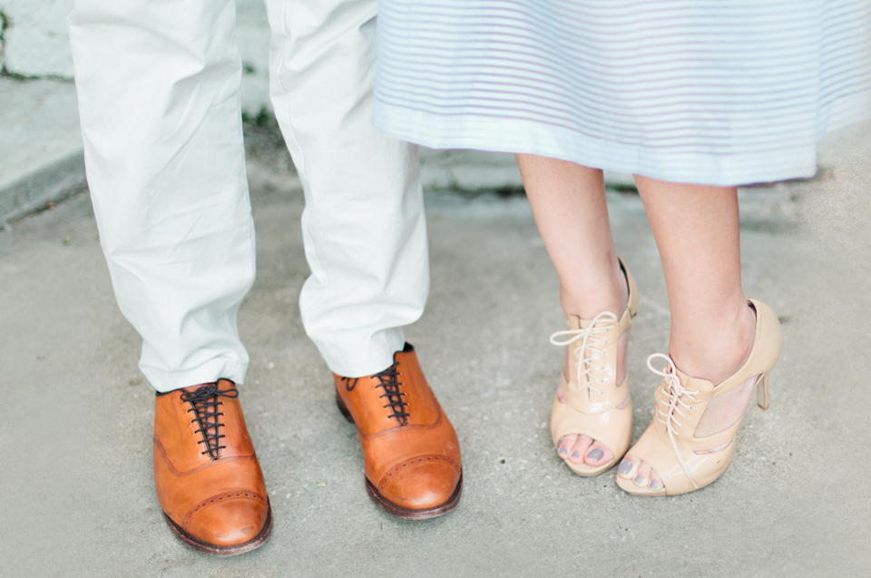 Picture of a couple and their cute shoes.  This picture was taken on the steps of the Henry B. Plant museum in Tampa, Florida.  These are engagement portraits.