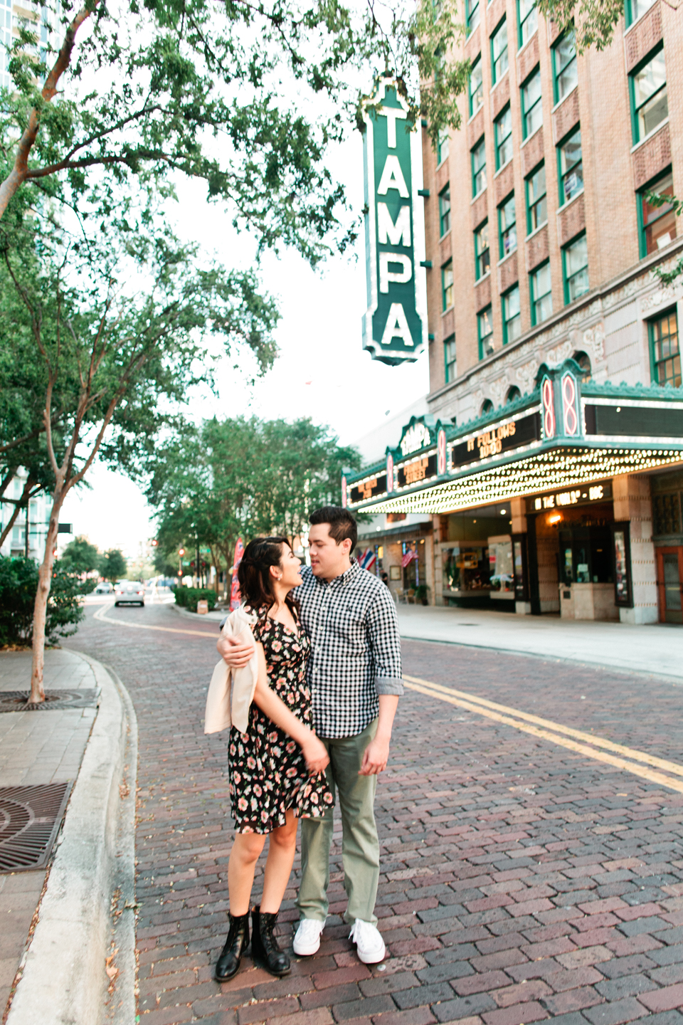 Image of an engaged couple in front of the Tampa Theater, downtown Tampa, Florida.