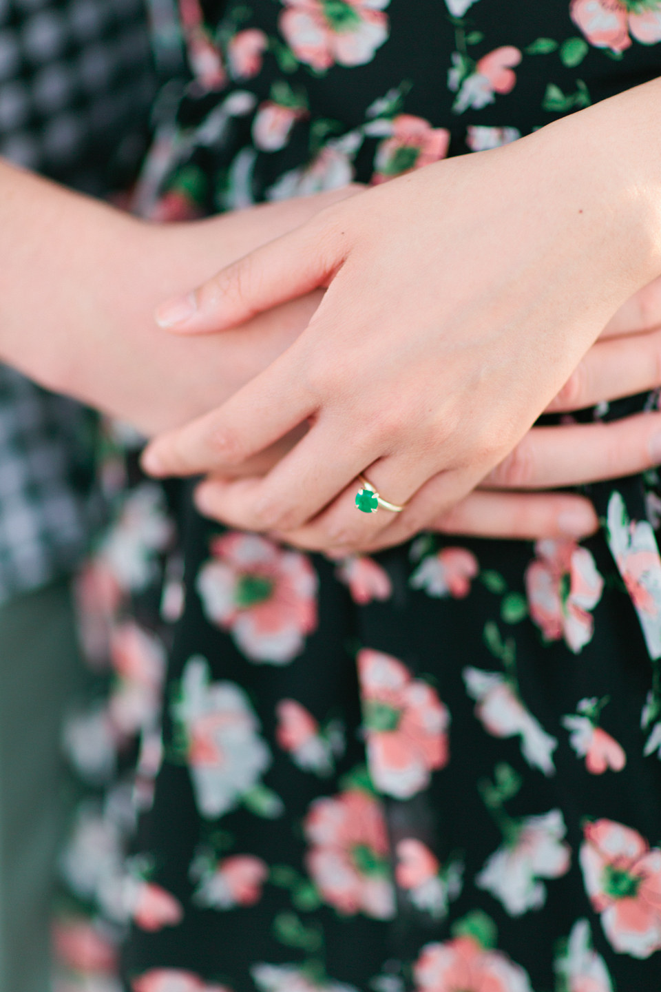 Picture of an engaged couple's hands.  The woman's engagement ring is shown in the center of the image.  This is at Curtis Hixon Waterfront Park in Tampa, Florida