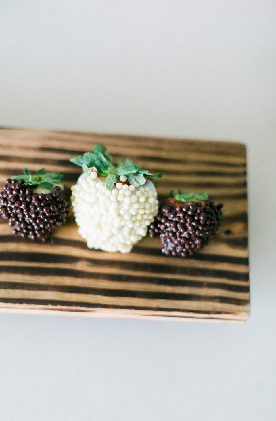 Image of chocolate covered strawberries on a wooden board at the Omni Amelia Island Plantation Resort.
