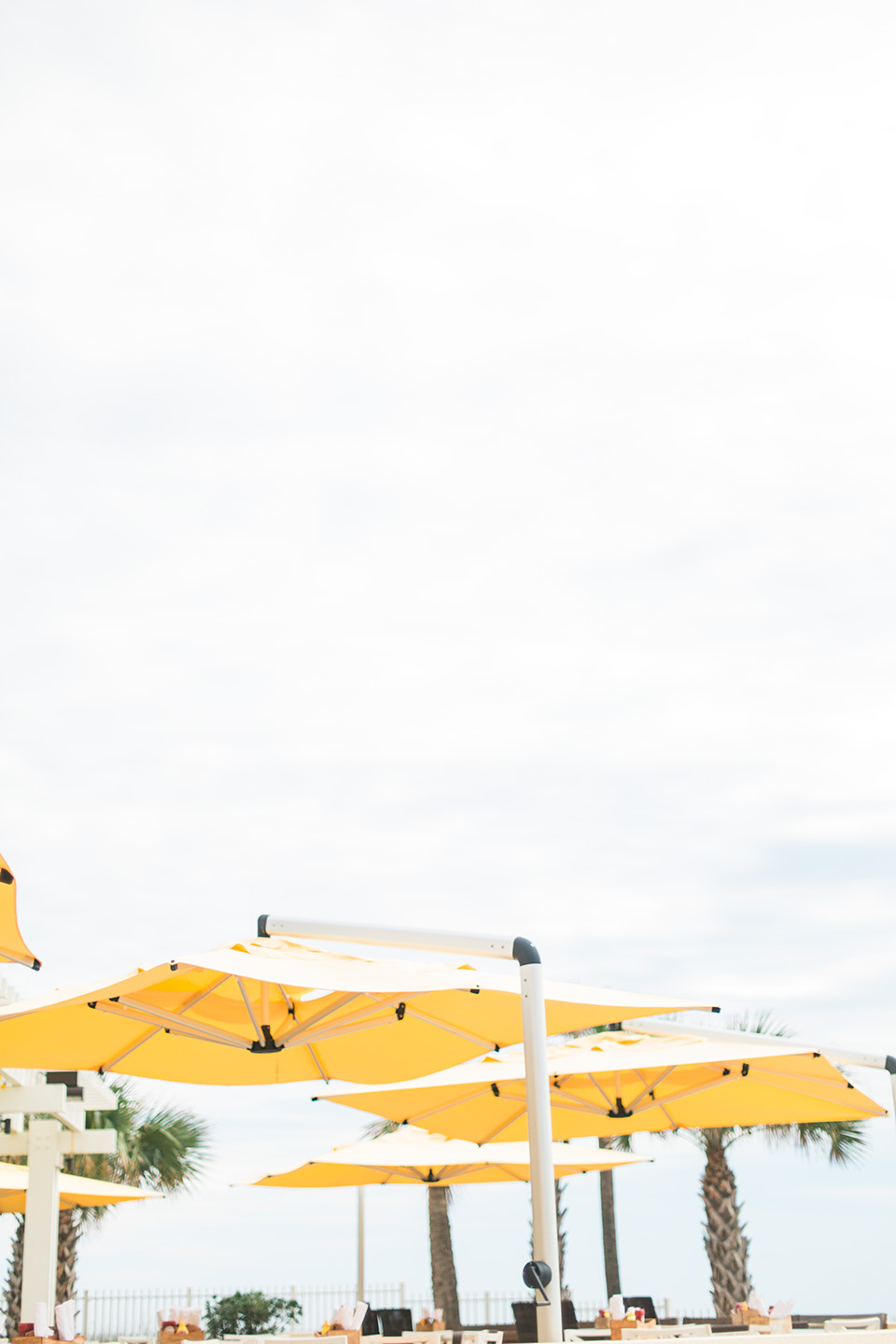 Image of bright yellow beach umbrellas at the Omni Amelia Island Plantation Resort.