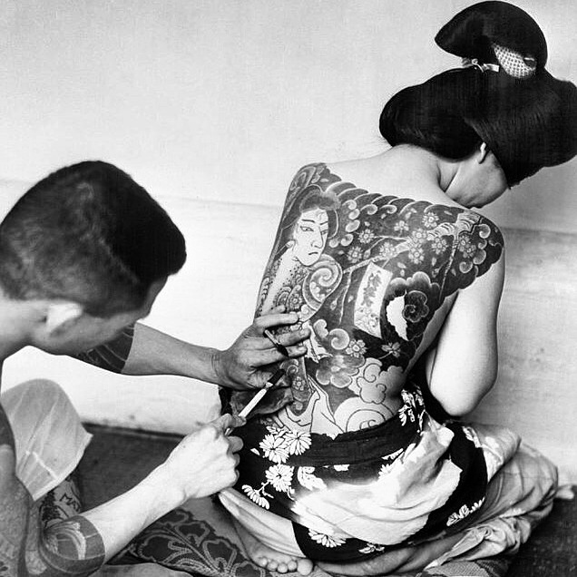 my inspiration for my signature design. this is a photo from 1954 of a womxn receiving her traditional tattoo. before meiji era in japan, womxn who were of lower class who were not allowed to wear the ornate kimonos, opted for these tats. they weren't as taboo as they became during the meiji era...& now they're still super taboo & considered yakuza as fawk. 