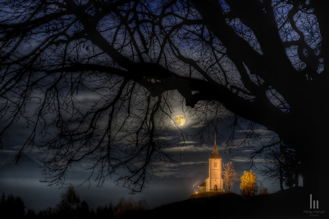 St. Primus church and supermoon above