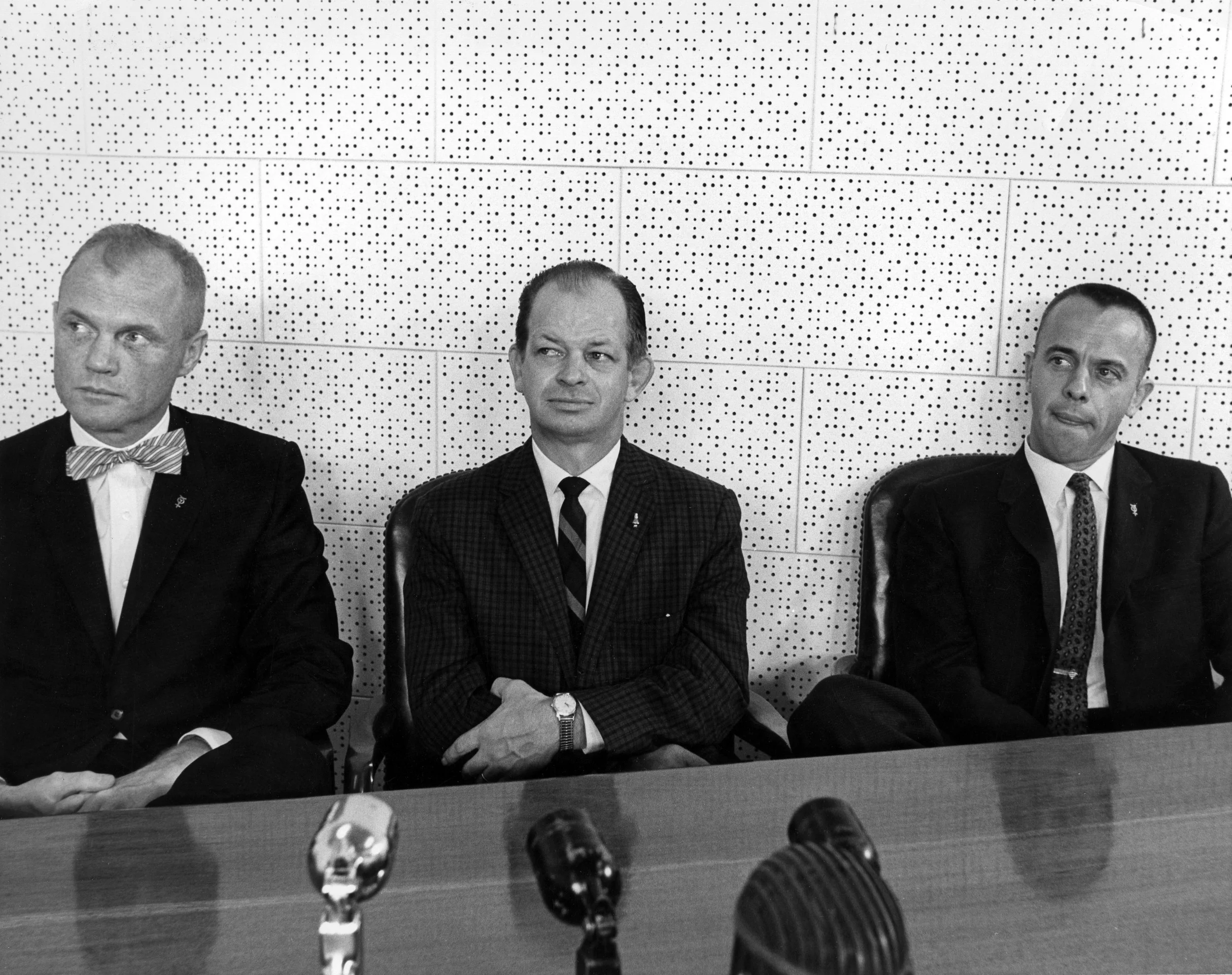 John "Shorty" Powers, the "voice of the Astronauts," sits between John Glenn and Alan Shepard during a press conference interview with the first American in space (Shepard) and the first American to orbit the Earth (Glenn).