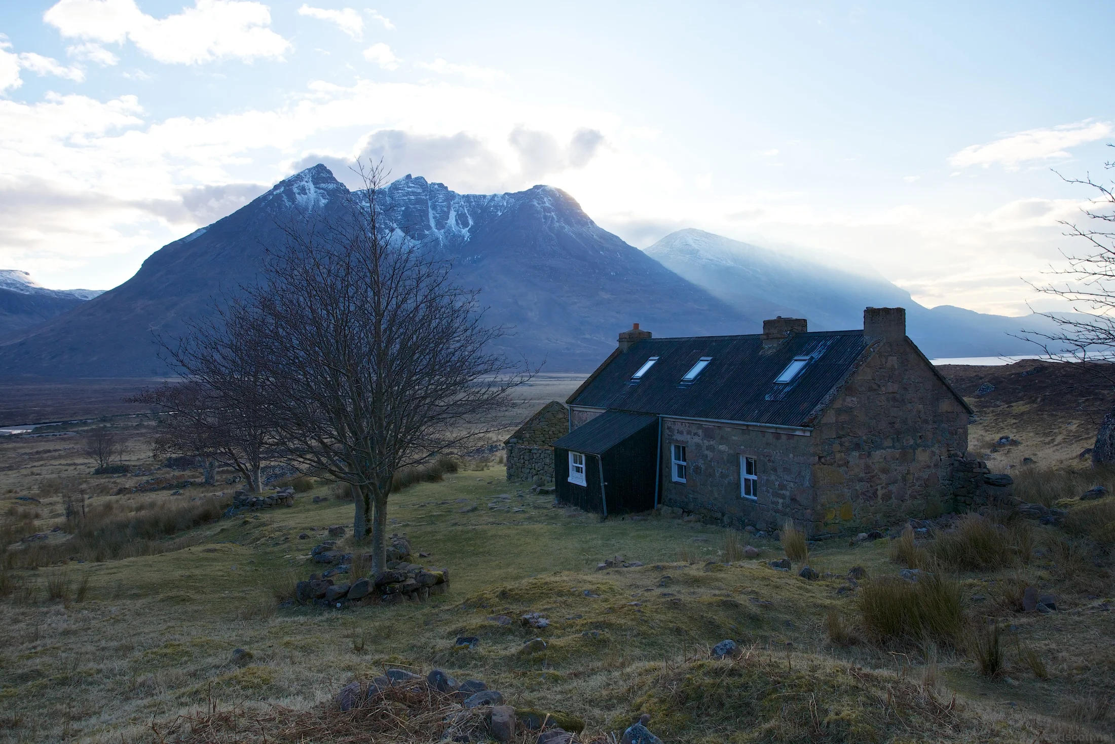 Shenavall Bothy. Facilities: roof, fireplace, spade, nearby stream. Location: priceless.
