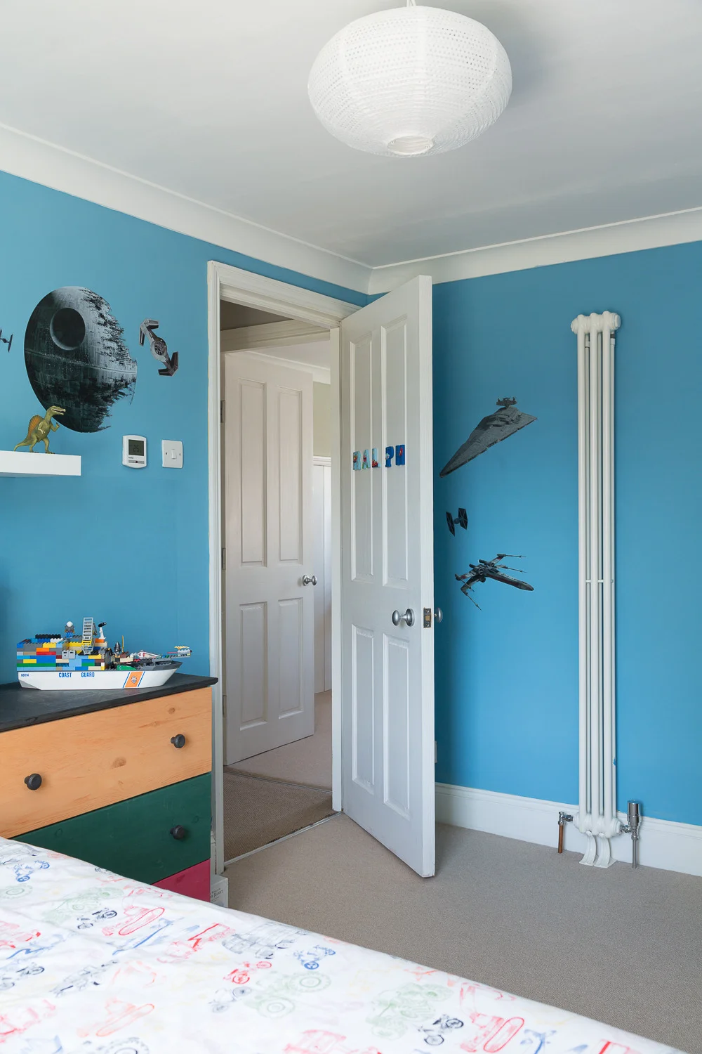 Installing a whole new heating system - which was needed anyway - allowed Chris to divide the house into multiple heating zones. So only areas that need to be heated can be heated, and only to the level required. Hence the thermostat - and slim radiator - in this bedroom.