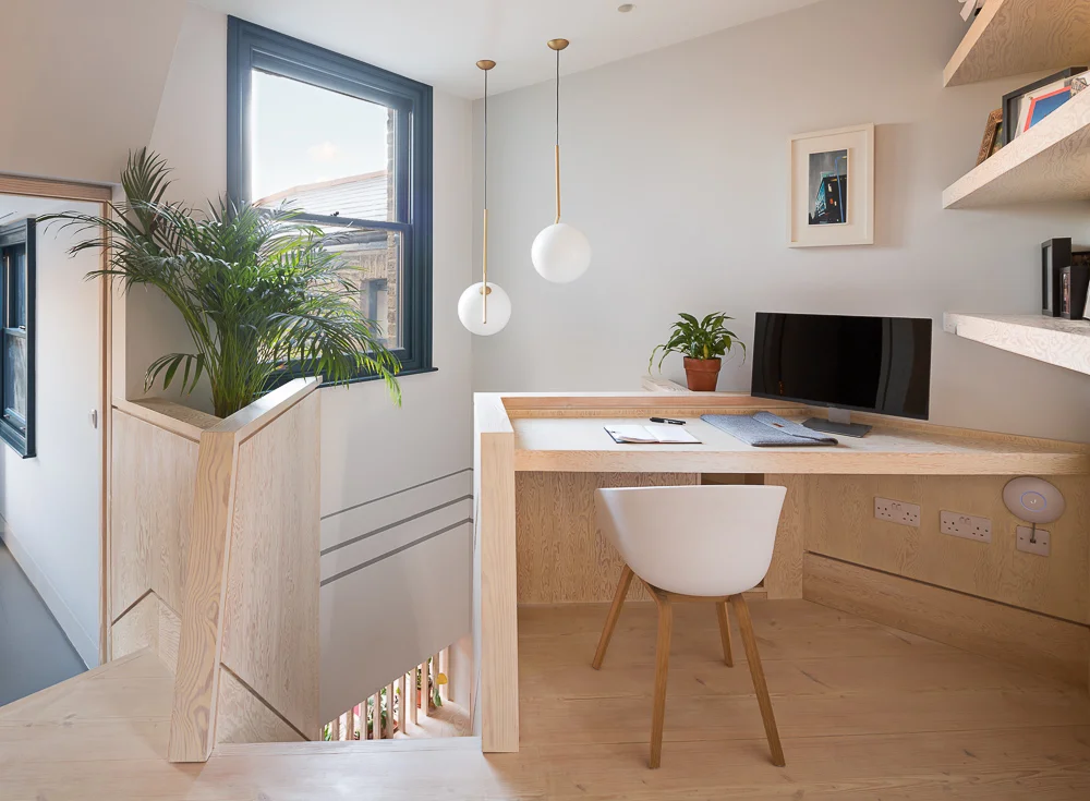 A bright workspace on the first floor landing - the landings become generous and usable spaces in the new configuration of the house