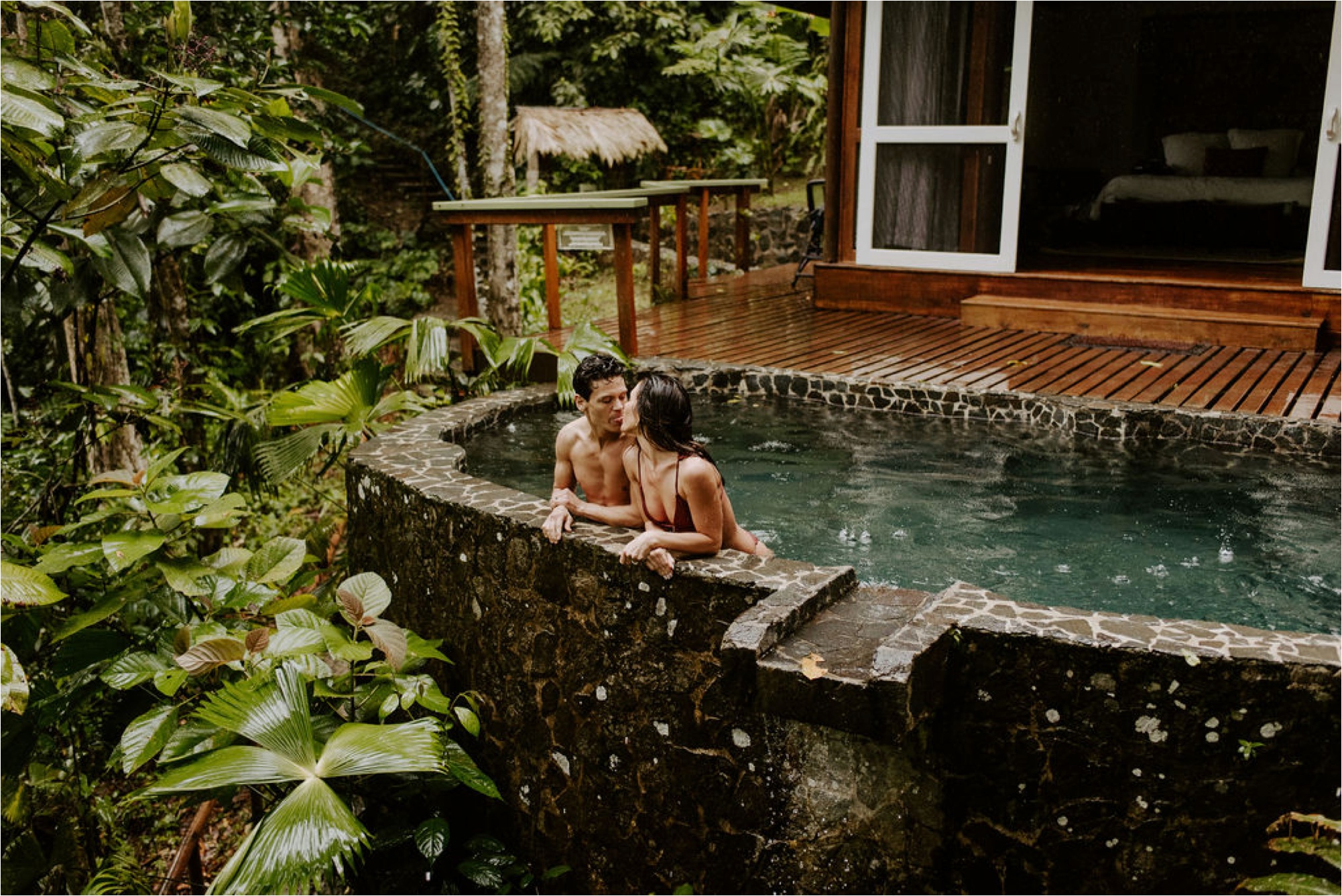  boho couple swimming elopement adventure photos pacuare lodge 