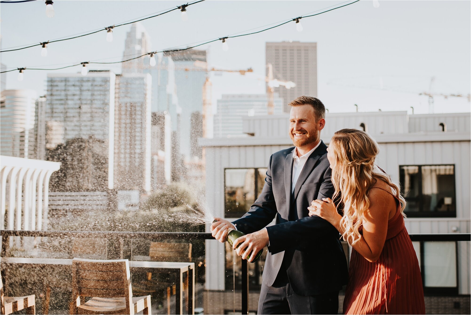  north loop minneapolis engagement session couple minnesota wedding photographer engaged photos summer instagram hewing hotel rooftop champagne celebrate 