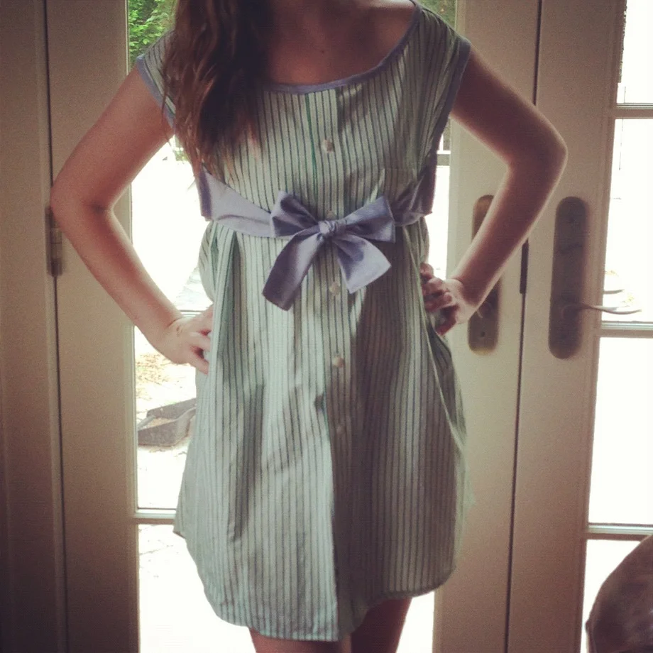  This is a dress I made out of a man's dress shirt and added trim and ties too by making bias tape out of another man's dress shirt. 