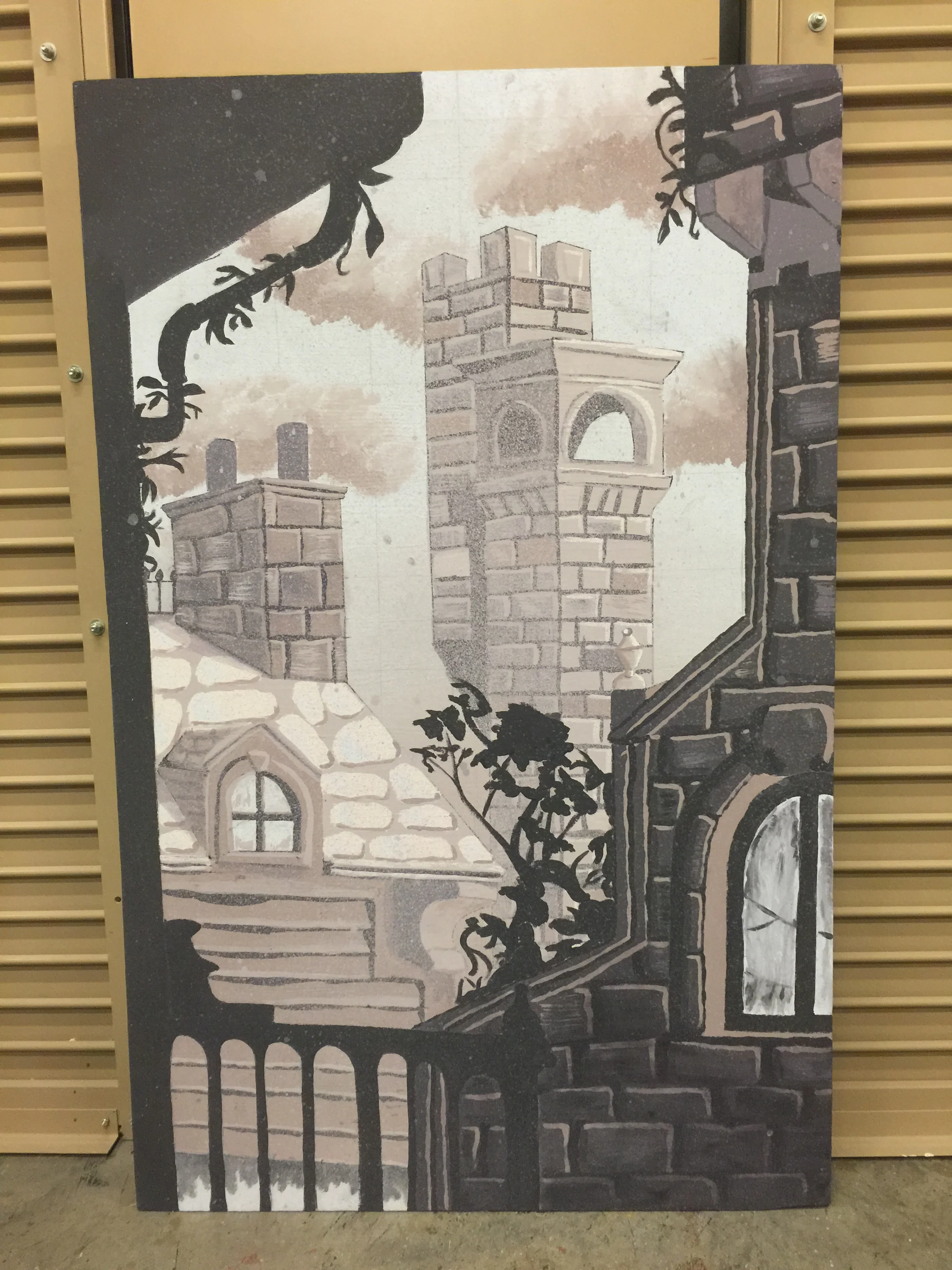  a scene painting project showing a collection of stone, paneled, and brick buildings on a 3.5x5' flat 