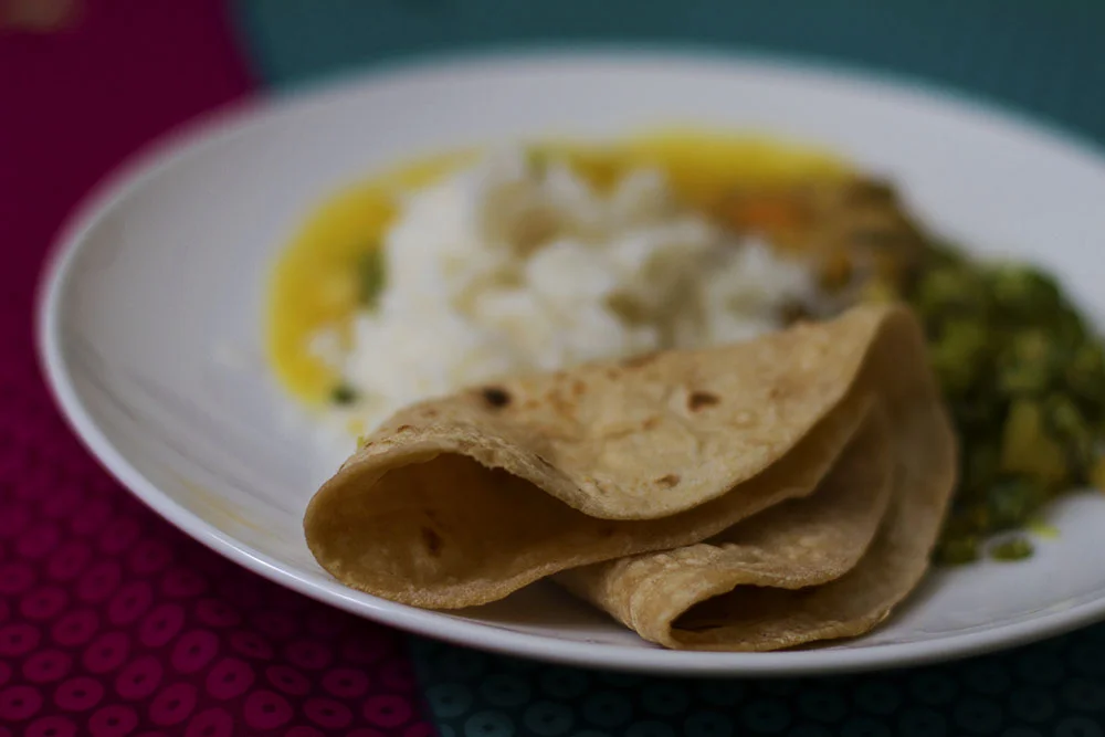 Chapati, white beans with pumpkins (pumpkin eriserry), dal, french bean fry and pineapple pachadi. 