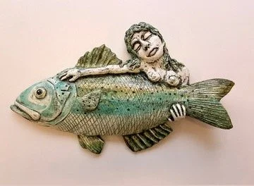 Floating goddess with fish