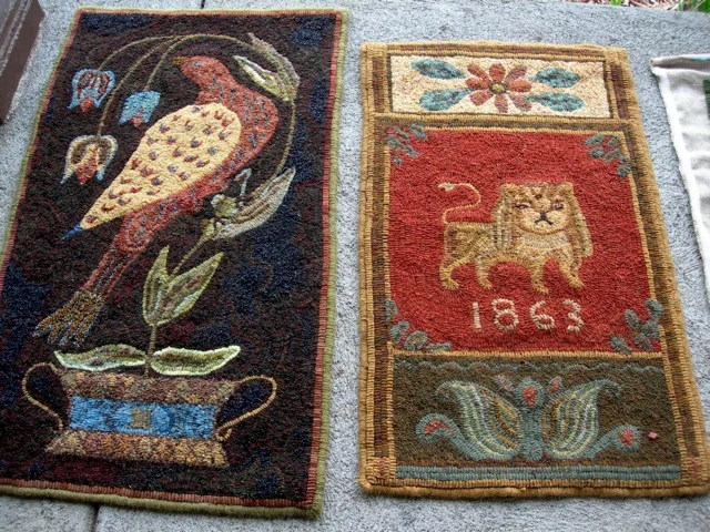 The "Virginia Fraktur" rug on the left was designed by Barb Carroll and hooked by Liz Gordon, using some paisley fabric in the bird's body. The rug on right was designed and hooked by Liz Gordon. She combined an antique coverlet lion and a Penn Dutch bookplate design.
