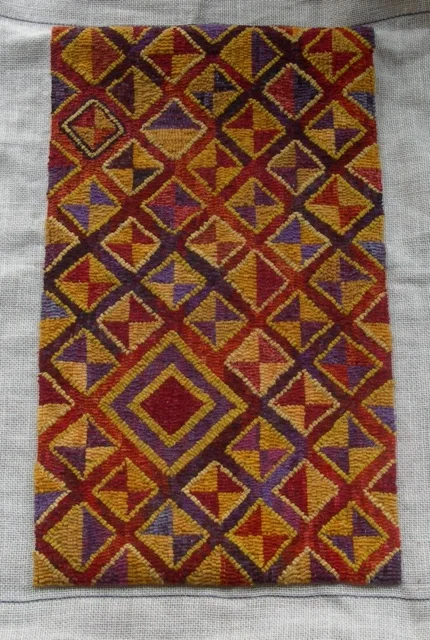 This beauty (awaiting its border) was designed and hooked by Beth Tembo. It's inspired by designs found in Kuba textiles made in Democratic Republic of the Congo (formerly Zaire).