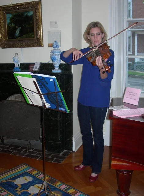 Sadie deWall of Little Owls Knit Shop serenading us.