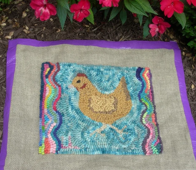 I finished hooking around Lucy's chicken. I'll make it into a pillow this week and mail it to her.