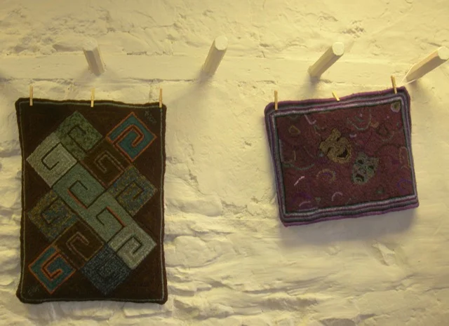 A couple of Emily's rugs on display.