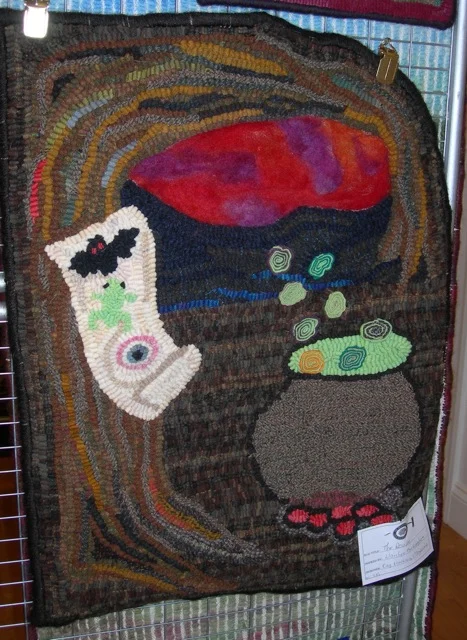 This is my pattern, The Recipe , hooked by another rug hooker. Fun to see hanging in the show!