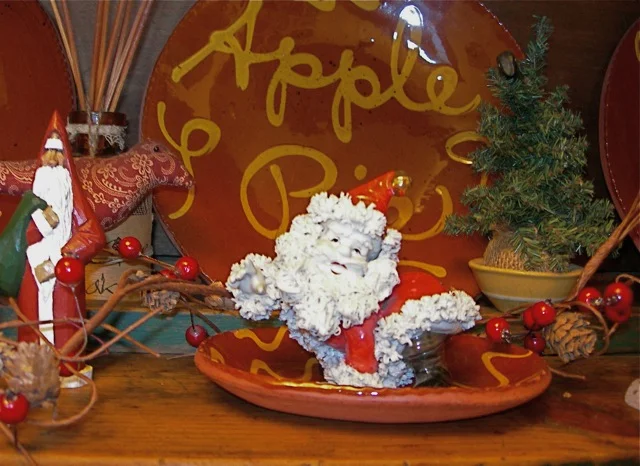I've had this ceramic Santa since my childhood. That definitely makes it an antique!