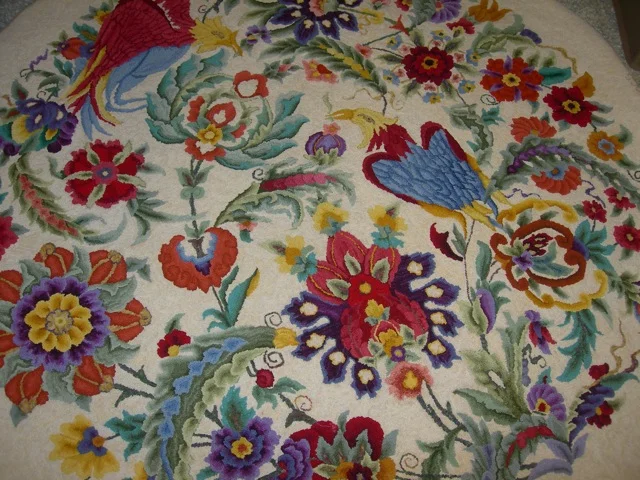 Another rug hooked by Marion Sachs. I love the bright colors on the light background.