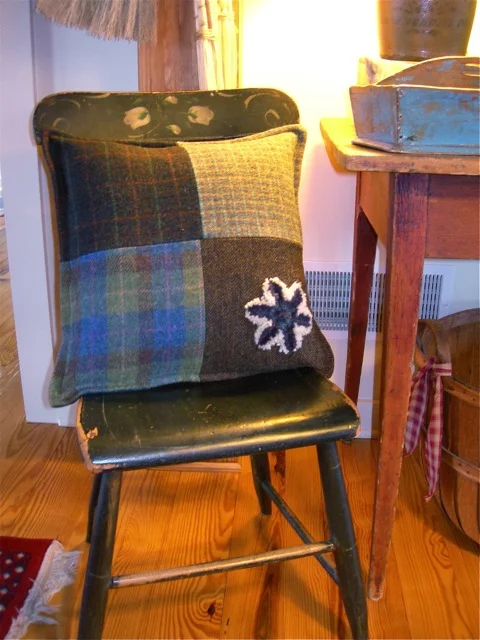 This pillow blends easily with our prim style of decorating.