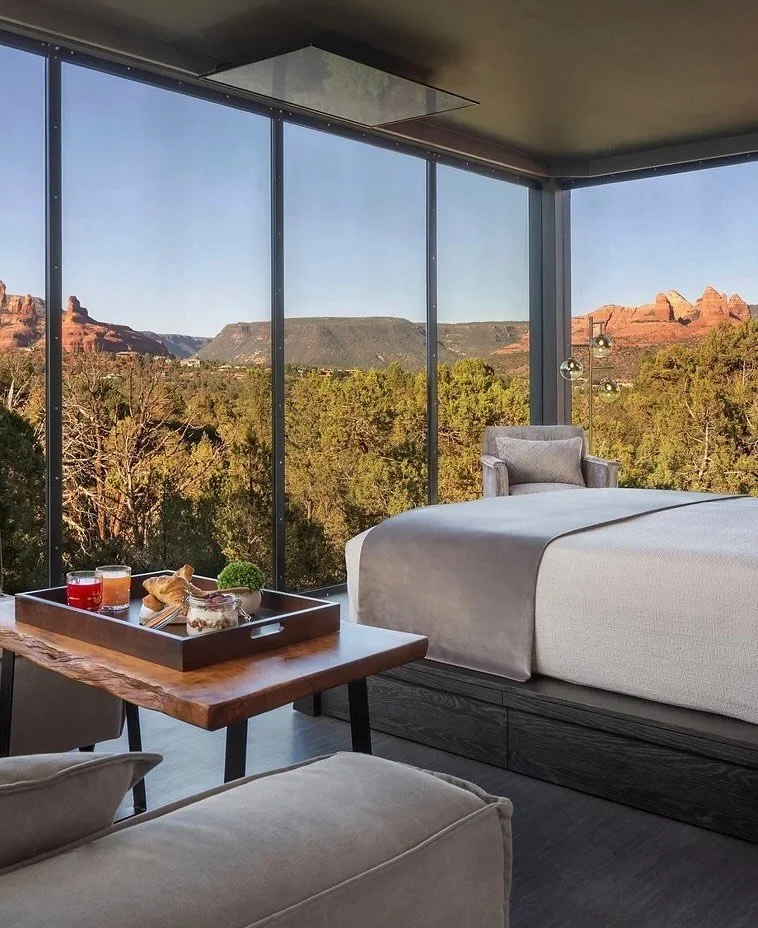 That moment when your bedroom view matches your screensaver.

Ambiente, a Landscape Hotel in Sedona, is a retreat sculpted into the red rock horizon. Its glass atriums rise like mirrored monoliths, reflecting cliffs, clouds, and the fiery desert sky.