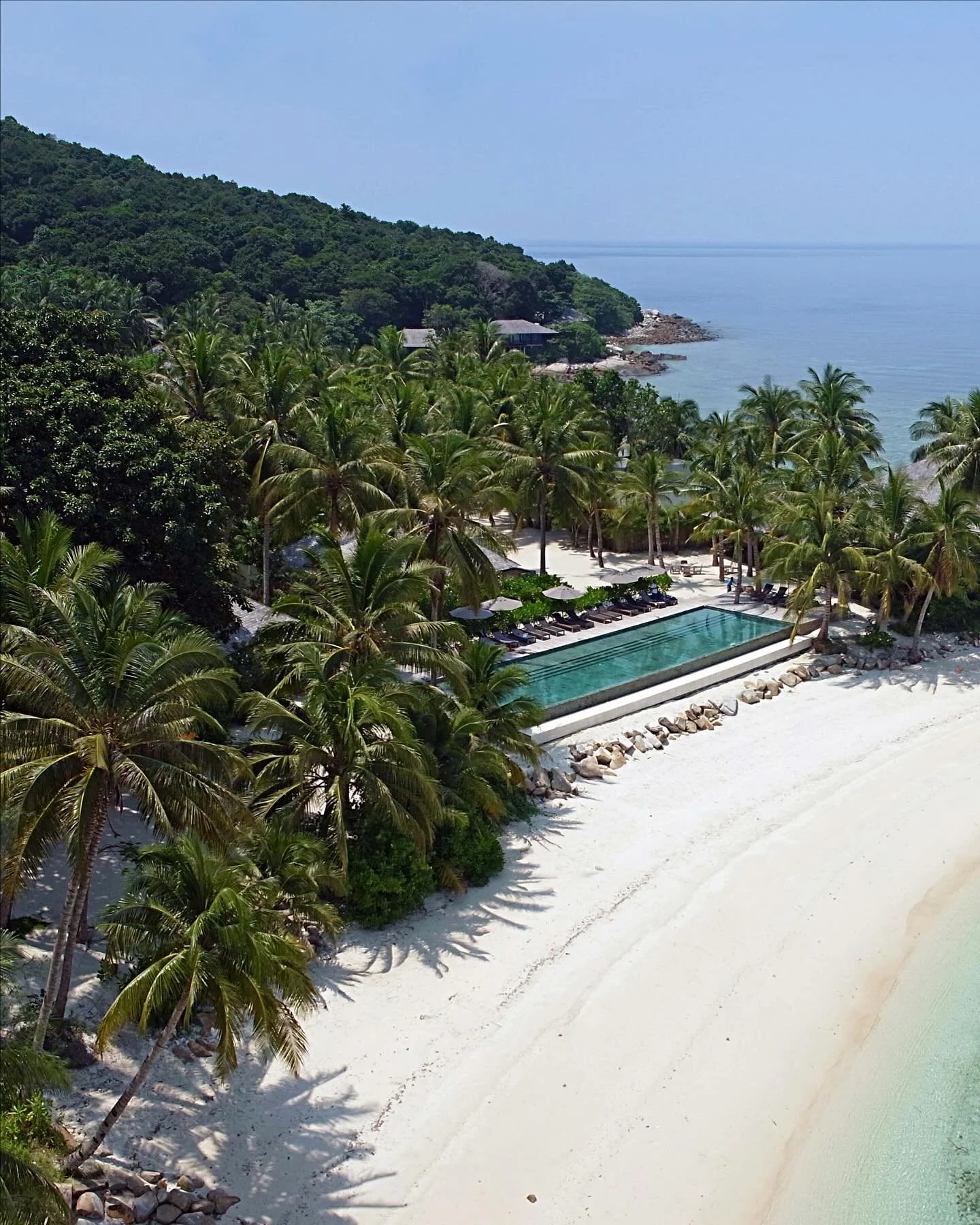 Located off the east coast of Malaysia, Batu Batu rests on Tinggi Island, a small tropical paradise fringed by white-sand beaches and coral reefs. The island lies within the protected Johor Marine Park, a mosaic of mangroves, jungle, and crystal-clea
