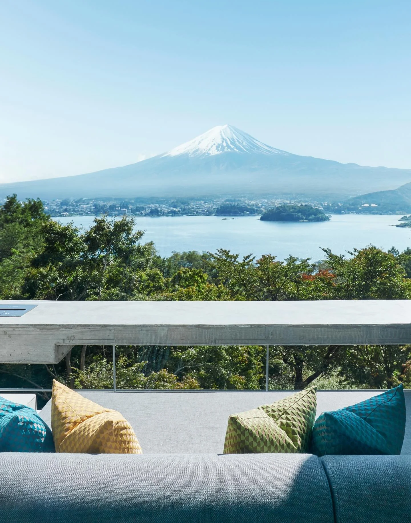 Hoshinoya Fuji leans into a Japanese idea that doesn&rsquo;t quite translate but instantly makes sense once you&rsquo;re there: kyūkei, the art of purposeful pause. Set in the quiet forests above Lake Kawaguchi, the resort frames Mount Fuji as a pres
