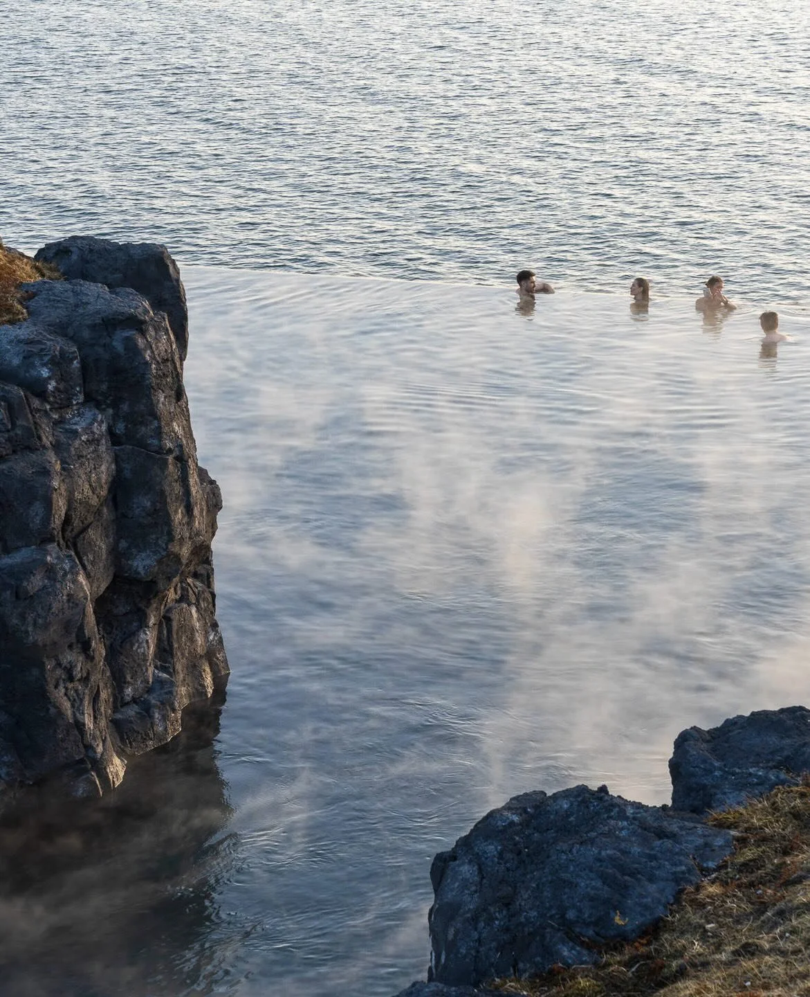 At the edge of the North Atlantic, where lava fields meet open sky, Sky Lagoon unfolds as a contemporary ritual shaped by Iceland&rsquo;s elemental landscape and long tradition of geothermal bathing. 

Warm mineral-rich waters trace the shoreline, in