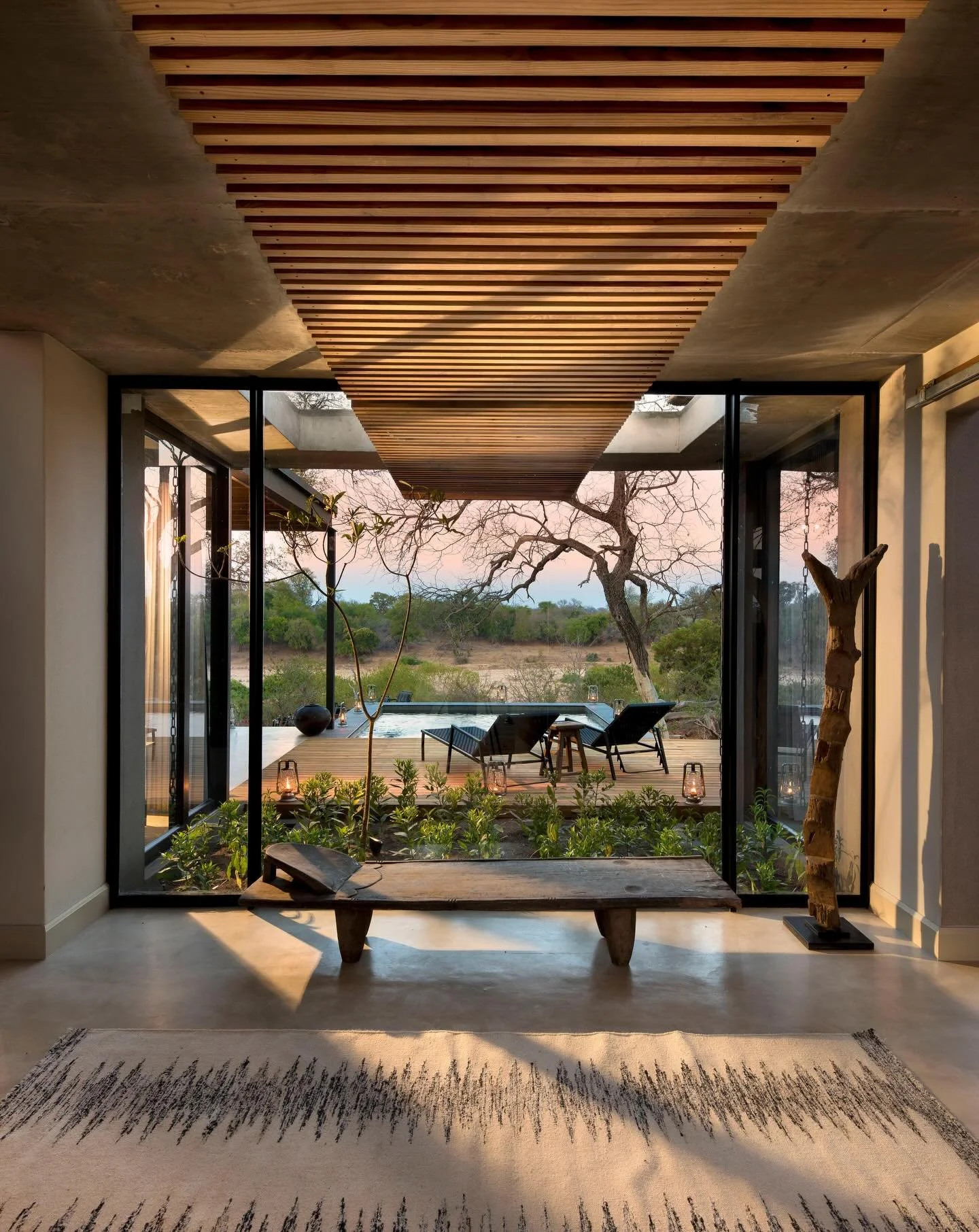 Set within the Sabi Sand Nature Reserve, part of the greater Kruger ecosystem in South Africa, Lion Sands Ivory Lodge unfolds along the Sabie River, where ancient trees, golden grasslands, and slow-moving water draw some of Africa&rsquo;s most extrao