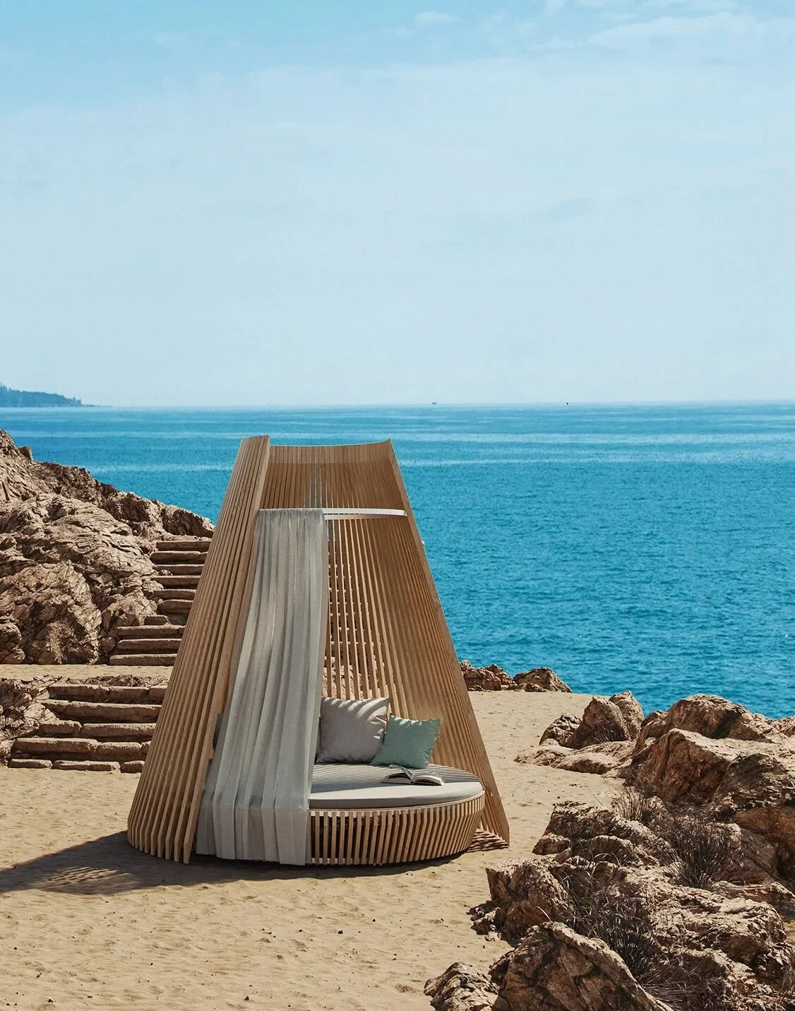 Designed by Atelier Lavit, HUT reading nest is a quiet architectural object that sits somewhere between shelter and sculpture. Formed from Siberian larch and shaped like a softened wigwam, it creates a cocoon-like space that opens gently to the sky w