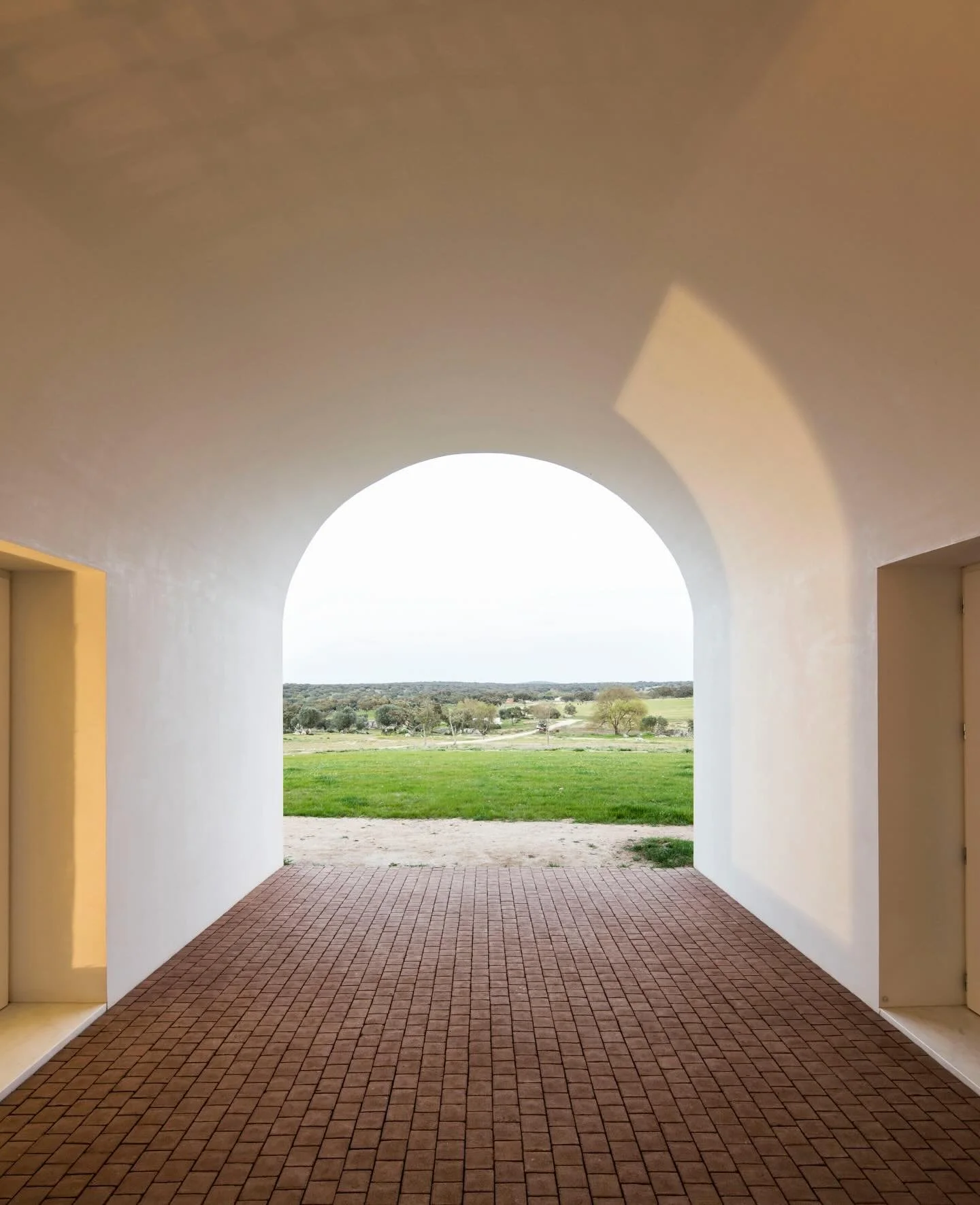 Set within the open plains of the Alentejo in southern Portugal, Casa No Tempo is defined by its quiet integration into the landscape. The architecture is low, linear, and intentionally restrained, allowing cork trees, wild grasses, and wide horizons