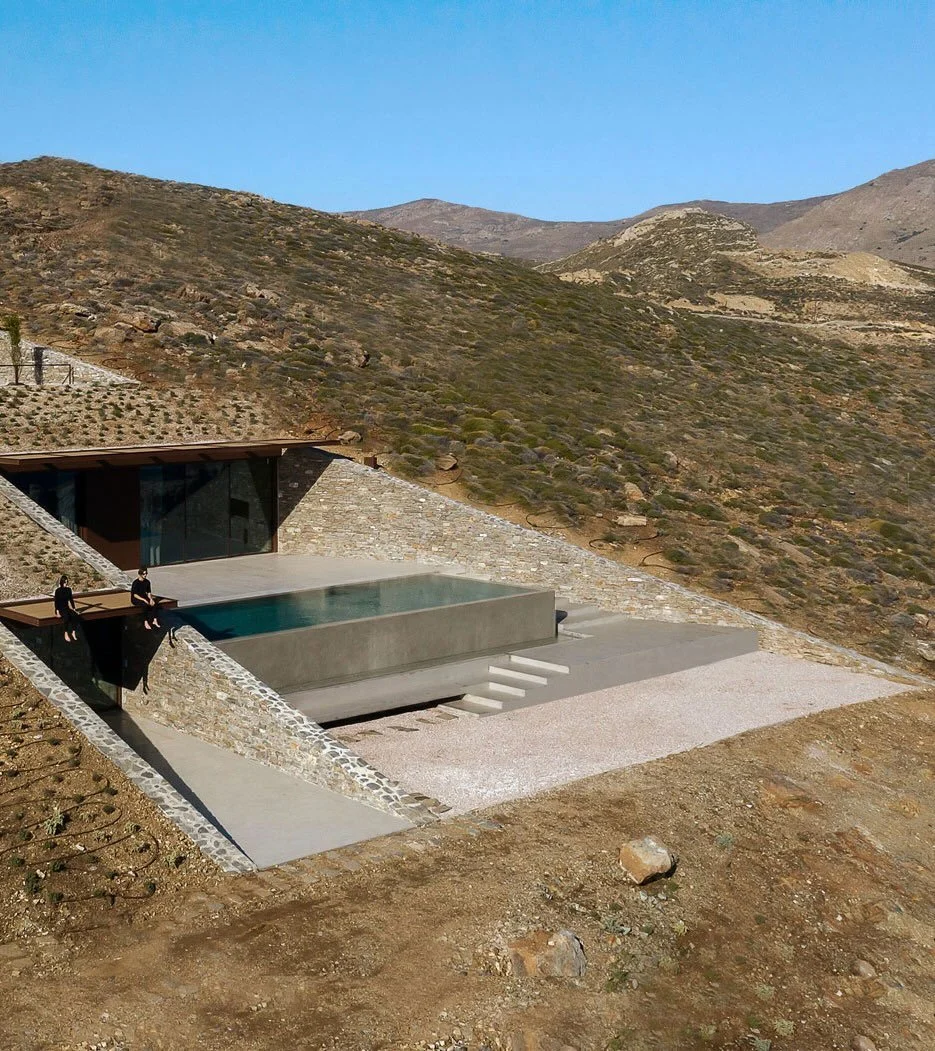 NCaved House by MOLD Architects is a space that makes you aware of the landscape itself. Set into the rocky cliffs of Serifos Island in Greece, the home was designed in direct response to the geography and climate of the Cyclades. The residence is ca