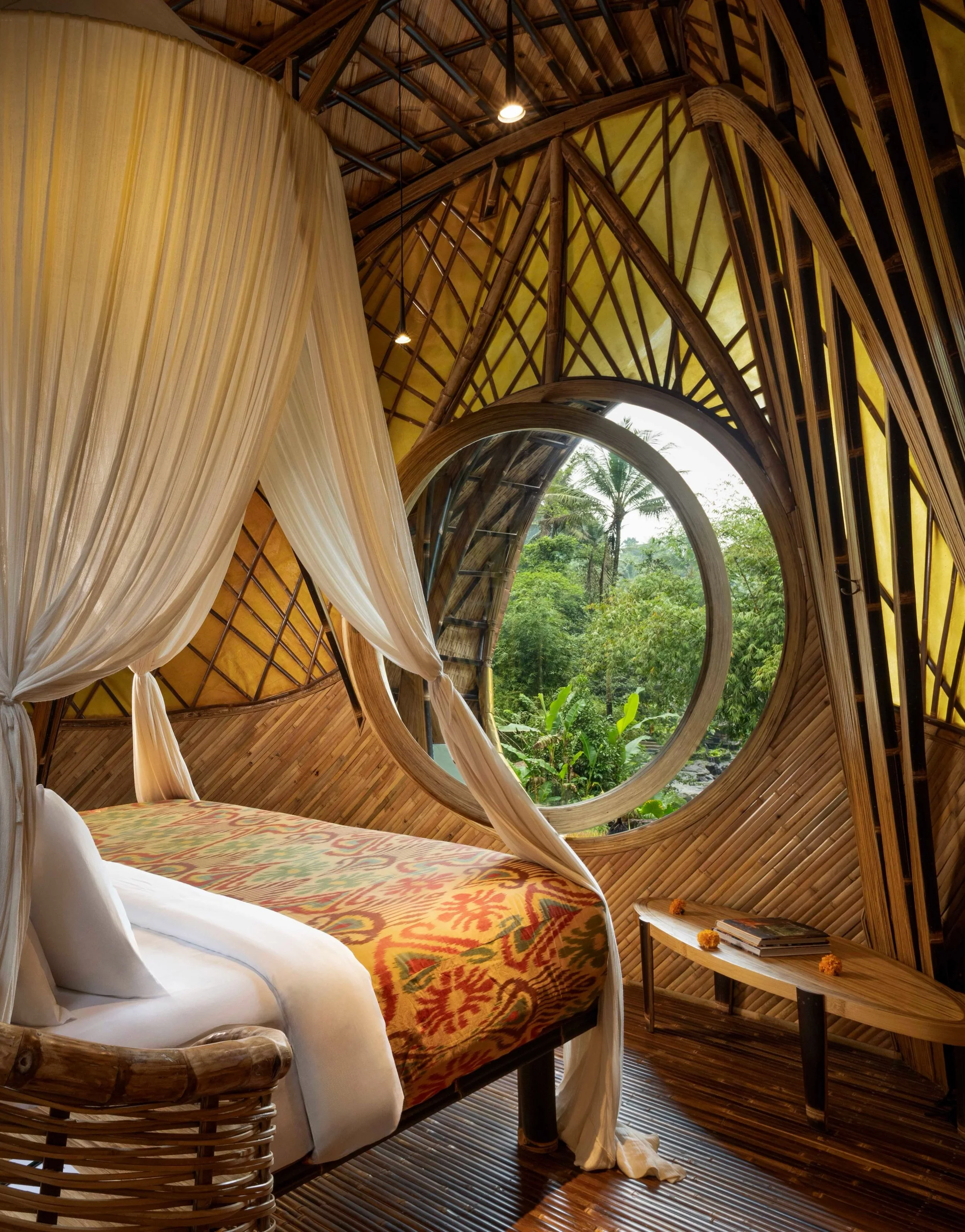 Along the emerald ridge of the Ayung River in Ubud, Bambu Indah understands that all interiors tell a story. This one speaks of a lifetime of global exploration, raw craftsmanship, and an unmediated connection to the earth. Conceived by founders John