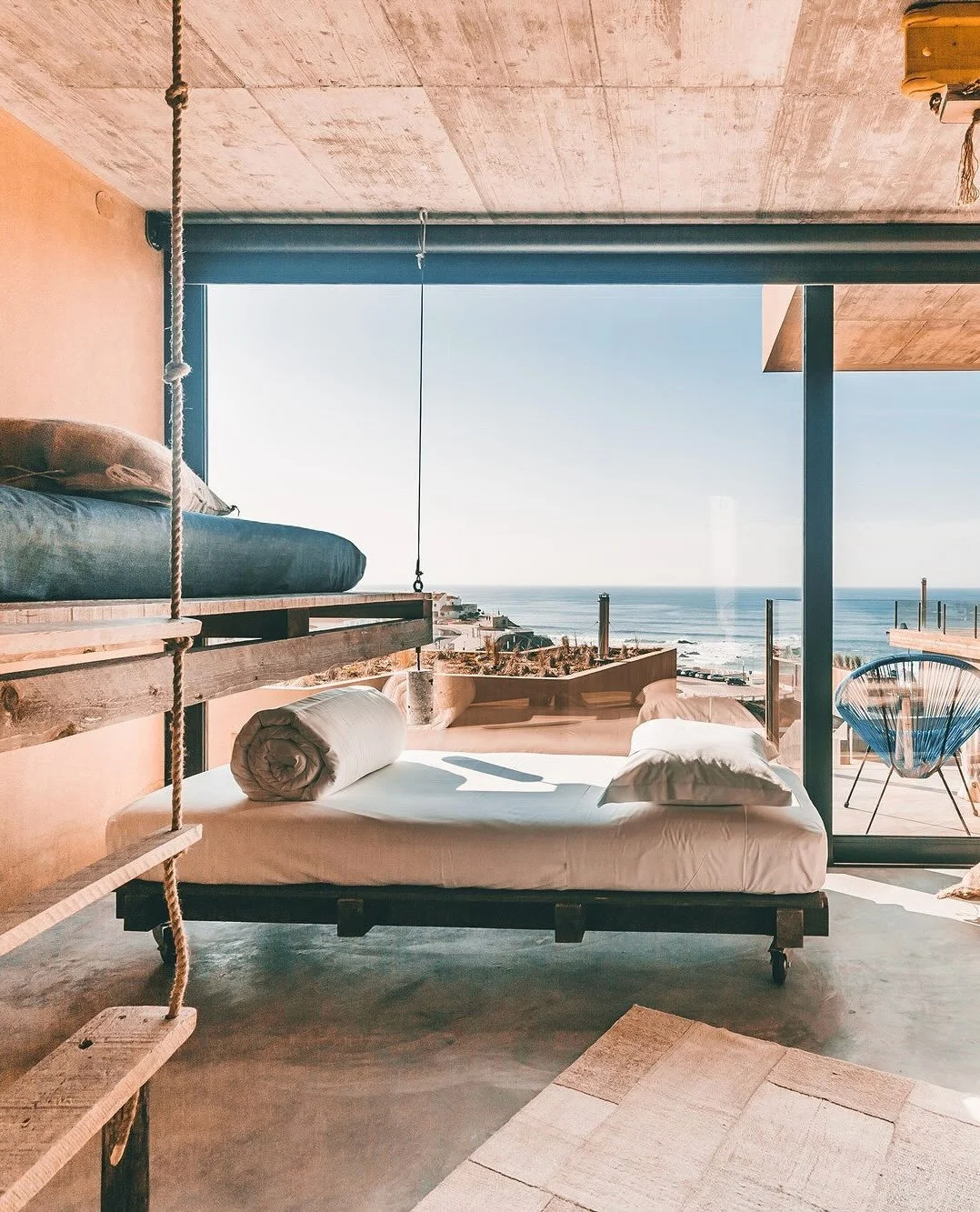 Set directly above the golden sands of Praia da F&iacute;sica in Santa Cruz, Portugal, Noah Surf House was brought to life by local founders Marta Fonseca and Gon&ccedil;alo Alves, who transformed a summer camp into an eco-conscious coastal sanctuary