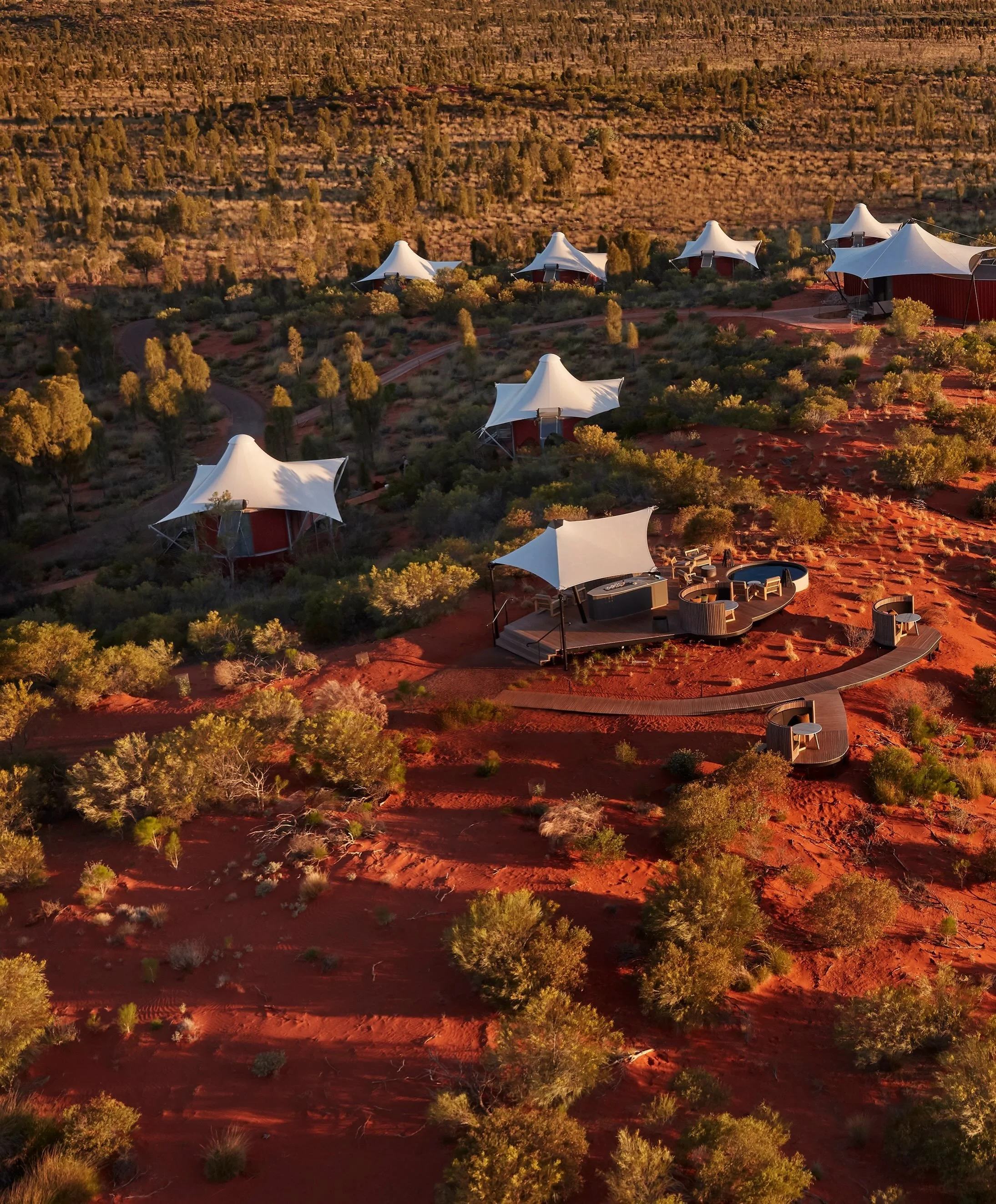Set in the heart of Australia&rsquo;s Red Centre, Longitude 131 lies among rust-colored sand dunes with direct, unobstructed views of the sacred monolith of Uluru. 

The sanctuary was designed to float above the fragile desert floor, using elevated s