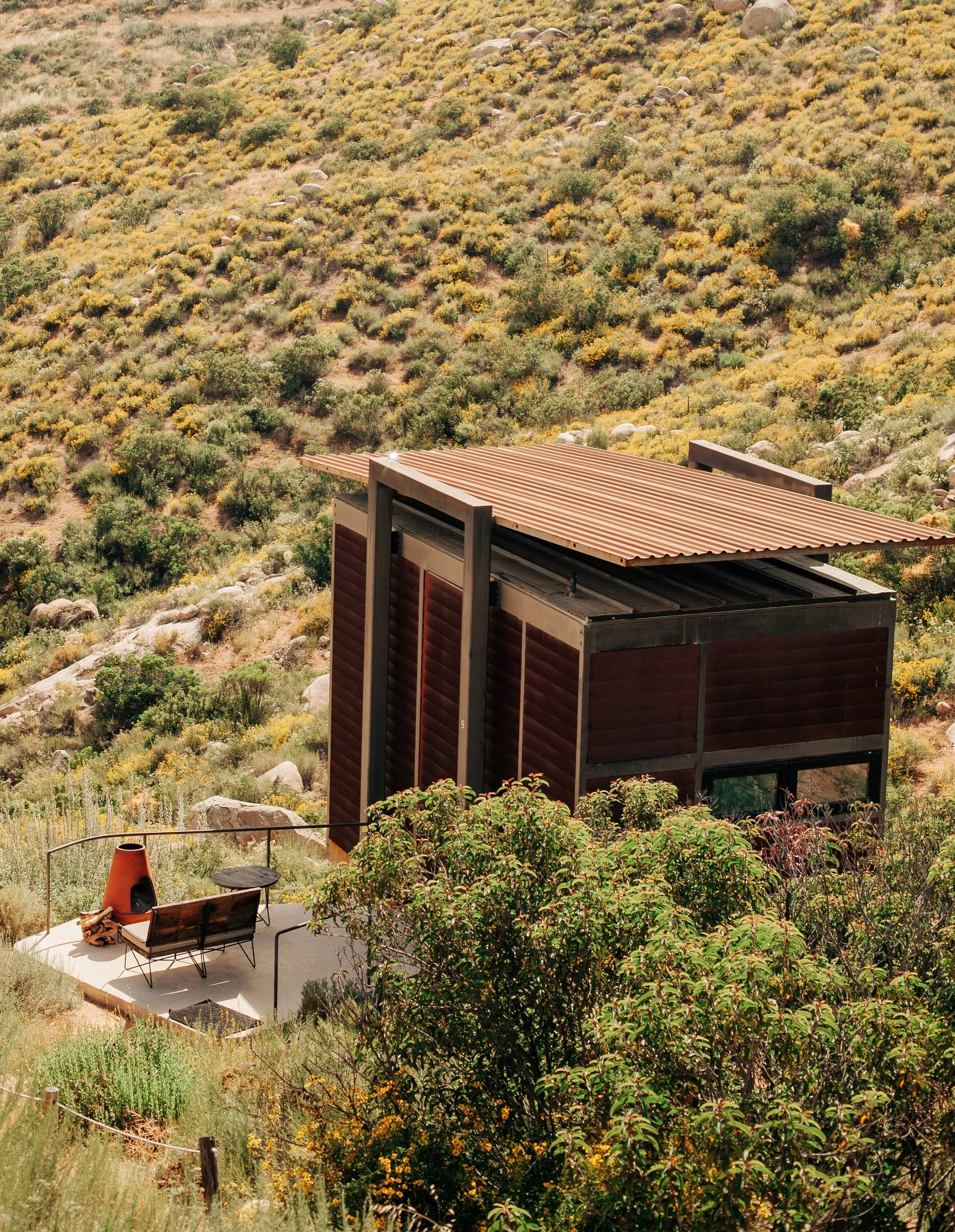 Encuentro Guadalupe seamlessly integrates modern design into the rugged, boulder-strewn hills of Baja California&rsquo;s Valle de Guadalupe. The eco-hotel consists of 22 minimalist steel-and-wood eco-lofts raised on stilts, designed to hover quietly 