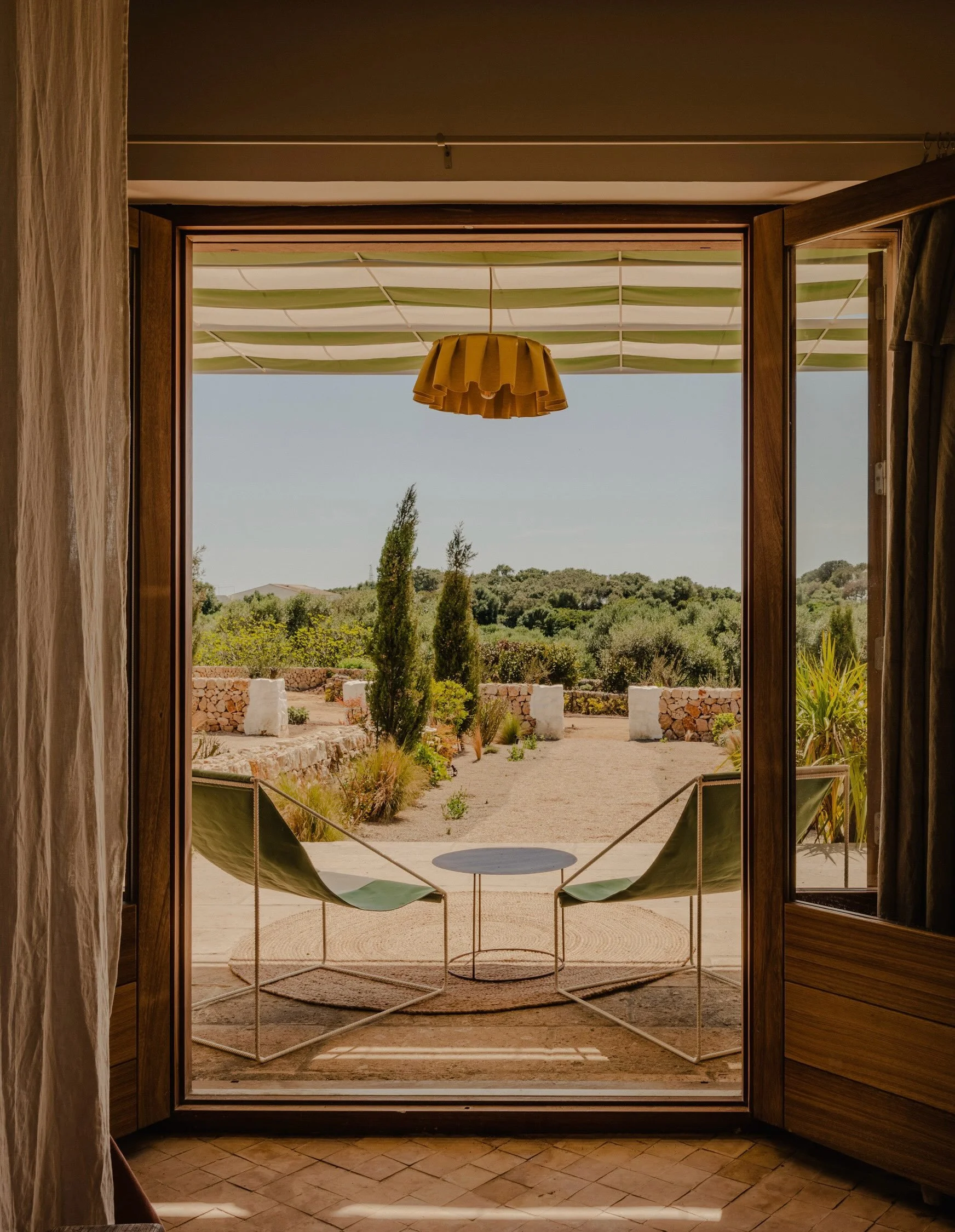 Hidden within the island&rsquo;s wild interior, Amagatay Menorca is a restored 19th-century olive farm turned rural sanctuary. Master craftsmen spent years reviving the estate&rsquo;s historic structures, using native mar&eacute;s limestone, exposed 