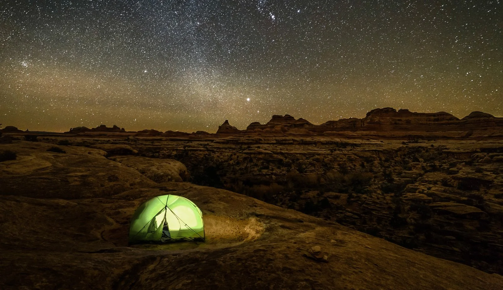 WebSocial_CanyonLands_DarkSky-stock-photo-lonely-tent-in-canyonlands-(2)-94188365-fullcropped.jpg