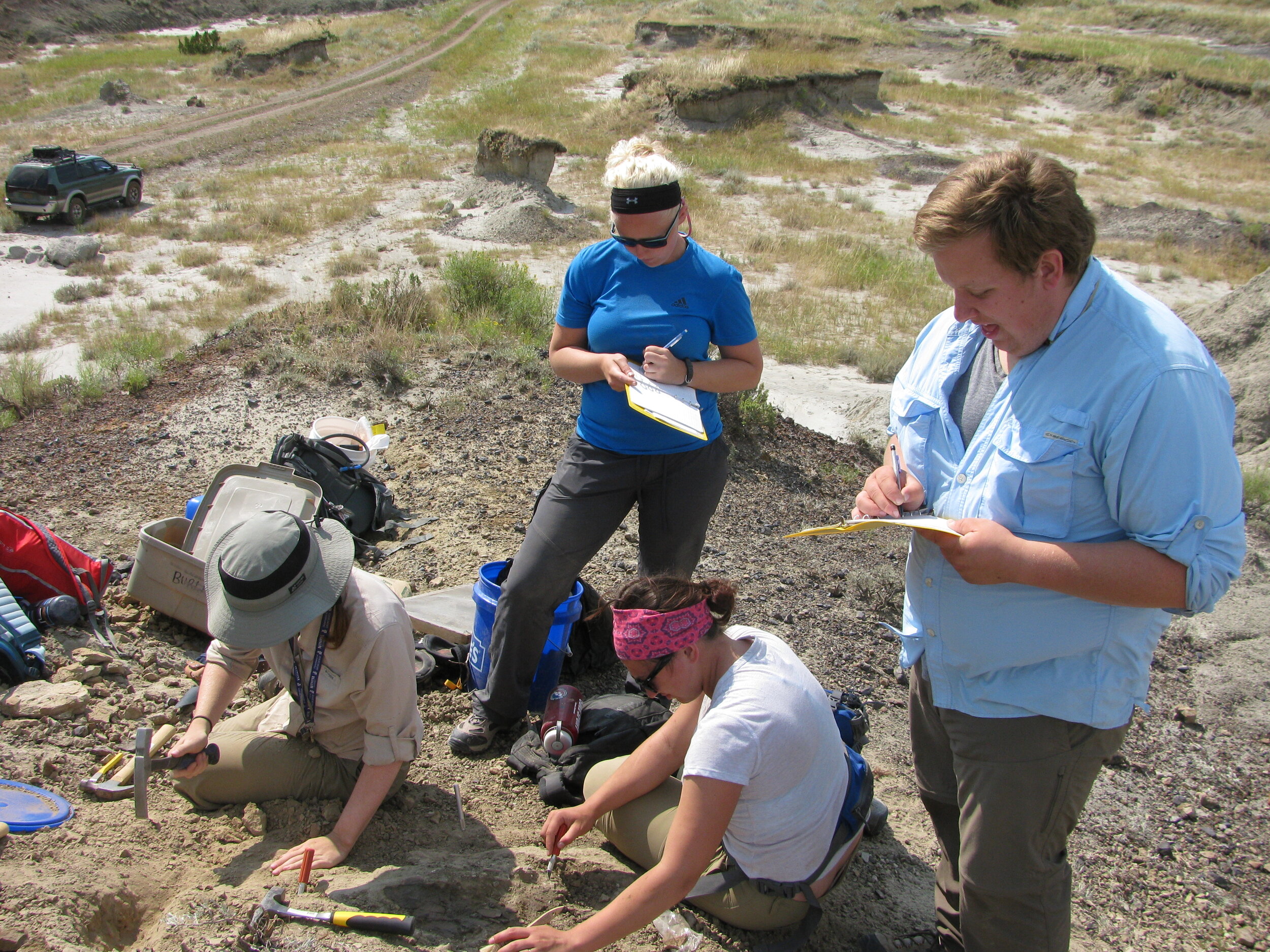 Students Take Notes at Dinosaur Dig Site