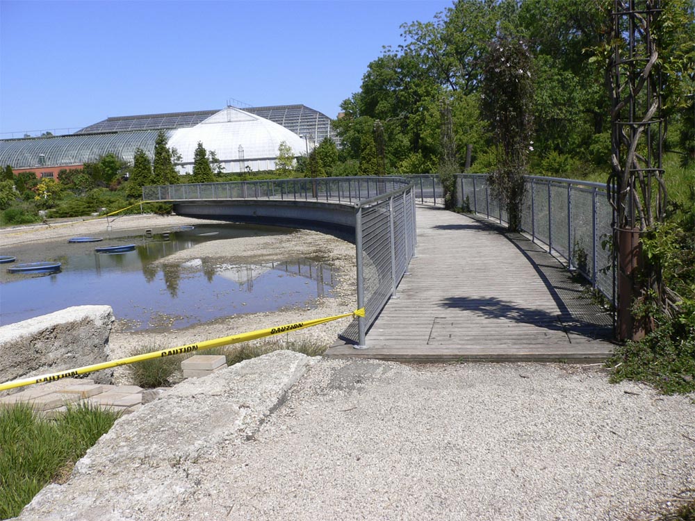 The bridge continues the curve of the great lawn.