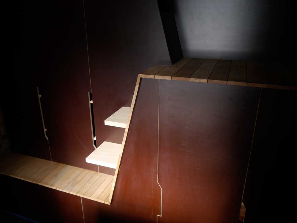A warm and cavelike space at the bottom of the building.