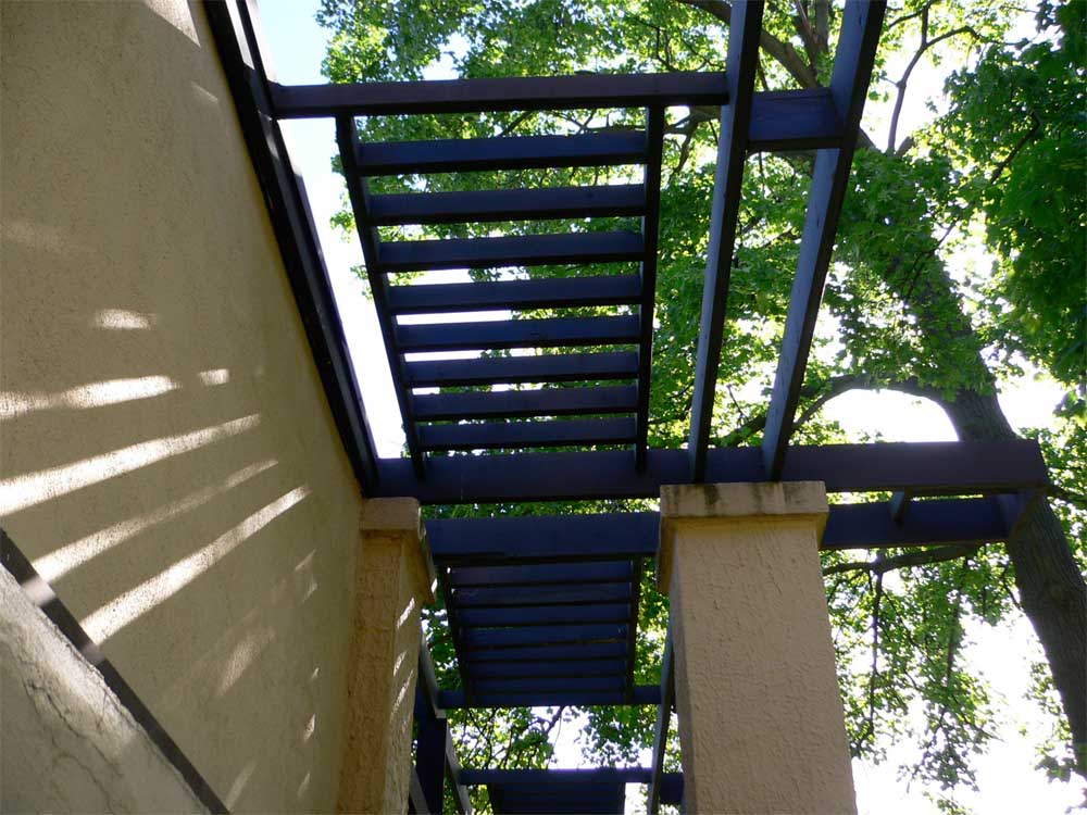 Light play through the overhead trellises.