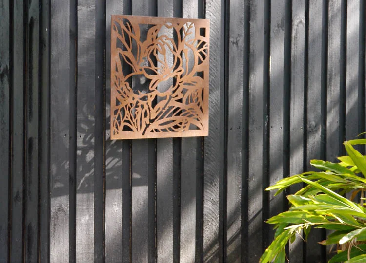 Nicole designed the weathered steel panel that marks the entry door.