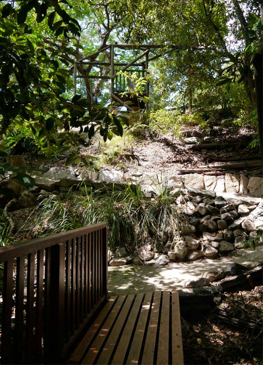 After crossing this bridge the path leads up to a play area that includes a flying fox.