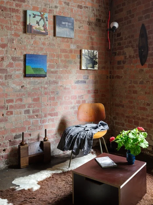 The warmth and texture of the existing brickwork was revealed after soda blasting. Concrete 'drips' running down the face of the brick shows the original method of constructing the concrete framed building.