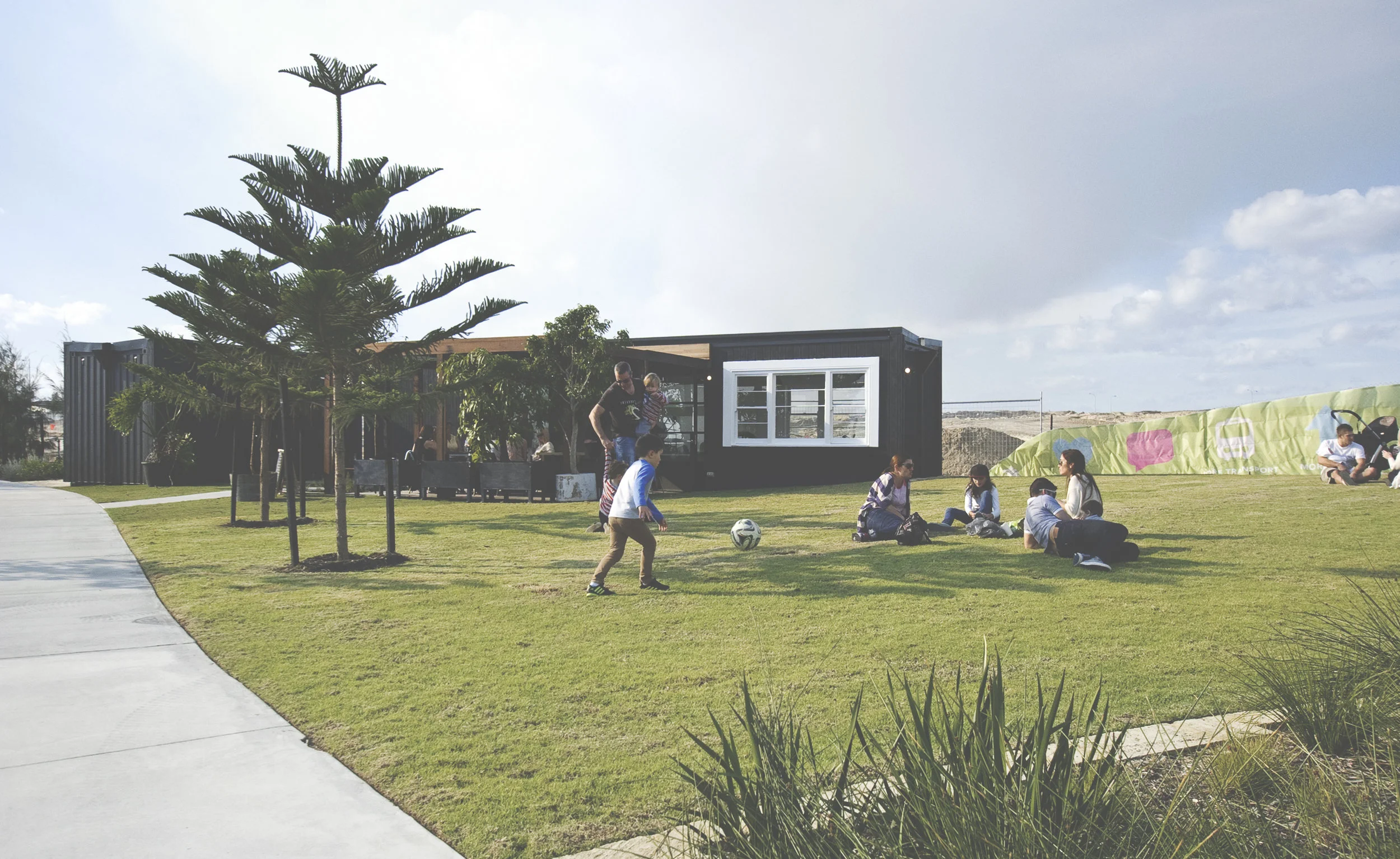 2 recycled shipping containers and a recycled timber pergola make up the space