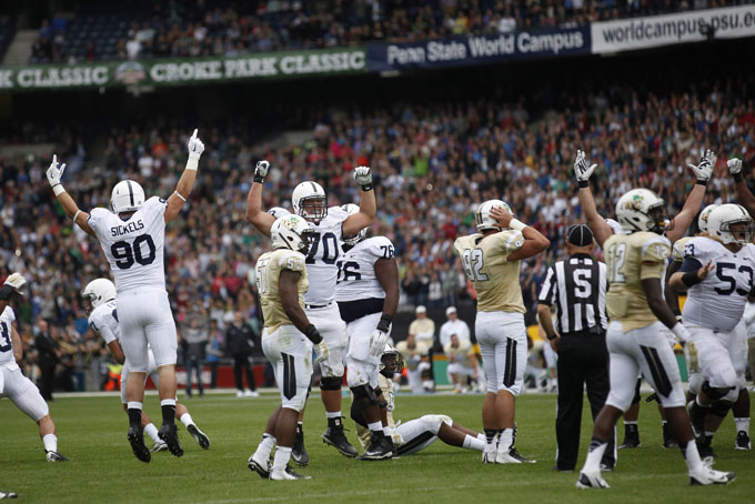 Penn State players celebrate after kicker Sam Ficken hit a 36 yard game winning field goal as time expired, 26-24 final score. 