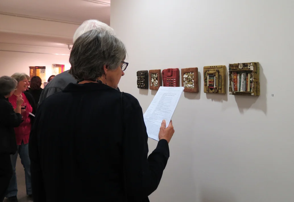  Exposition guests at the opening (work by Diane Savona) 